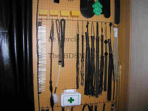picture of the middle right side of the outside wall with the BDSM toys on it