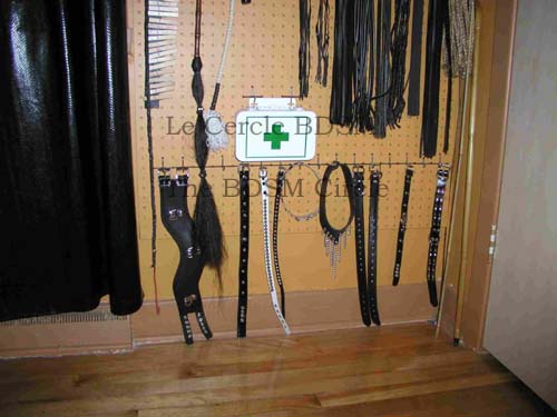 picture of the bottom of the right outside wall where the BDSM toys hang